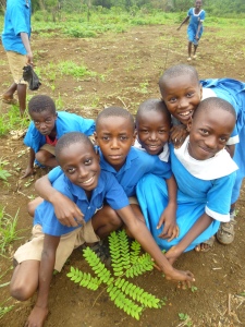 Some of the kids posing with a newly planted tree