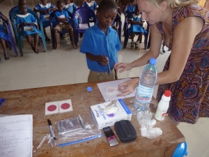 Water testing during water and sanitation classes with the primary school